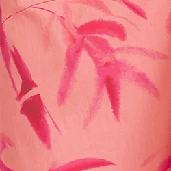 Peach and pink maxi-length dress with palm leaf print