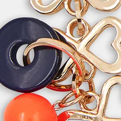 Gold-tone heart-shaped chain necklace with resin charms