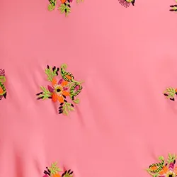 Peach embroidered front-tie mini skirt with fringes