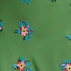 Dark green embroidered front-tie mini skirt with fringes