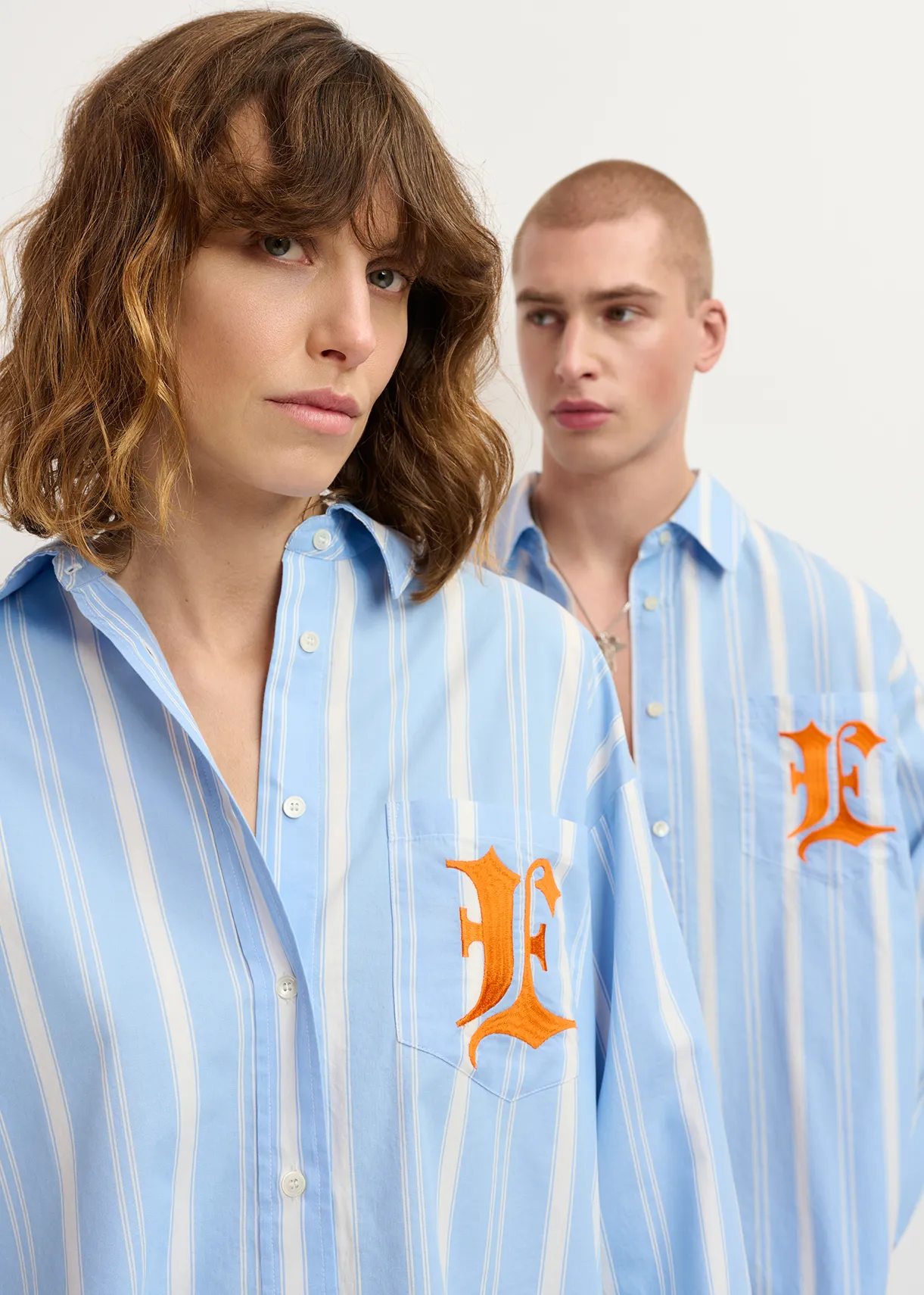 Blue, white and orange striped cotton shirt with 'E' embroidery