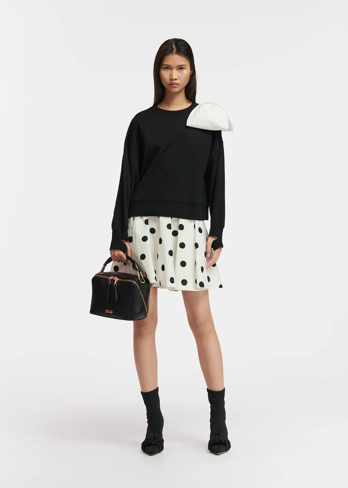 Black sweatshirt with white bow