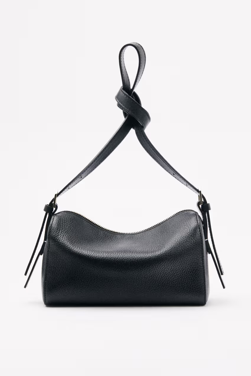 Camera Case Never Complete in pelle