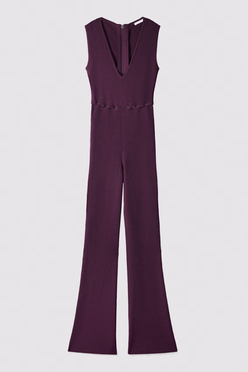 Tuta aderente con scollo profondo in maglia