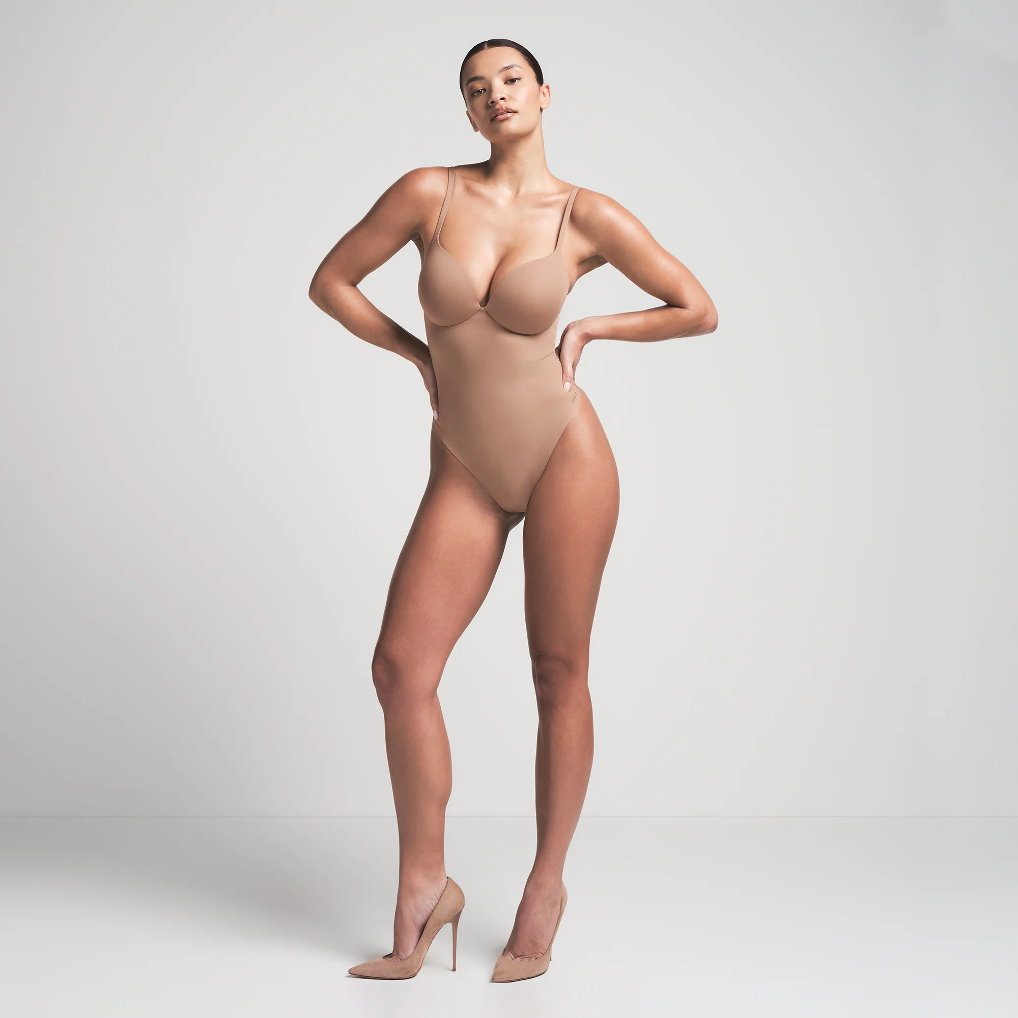 SKIMS ULTIMATE BODY PUSH-UP THONG BODYSUIT | ONYX