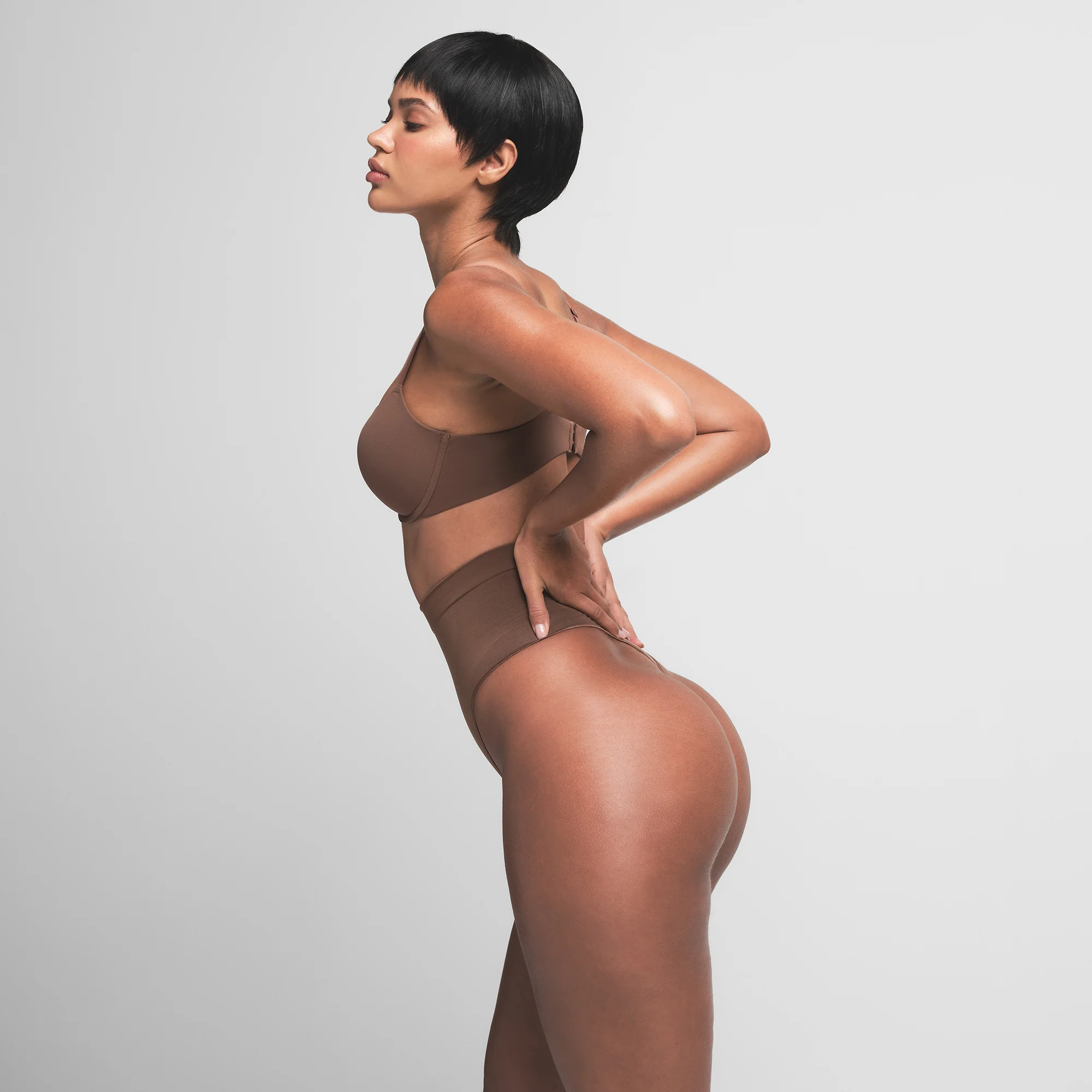 SEAMLESS SCULPT MID WAIST THONG | OCHRE