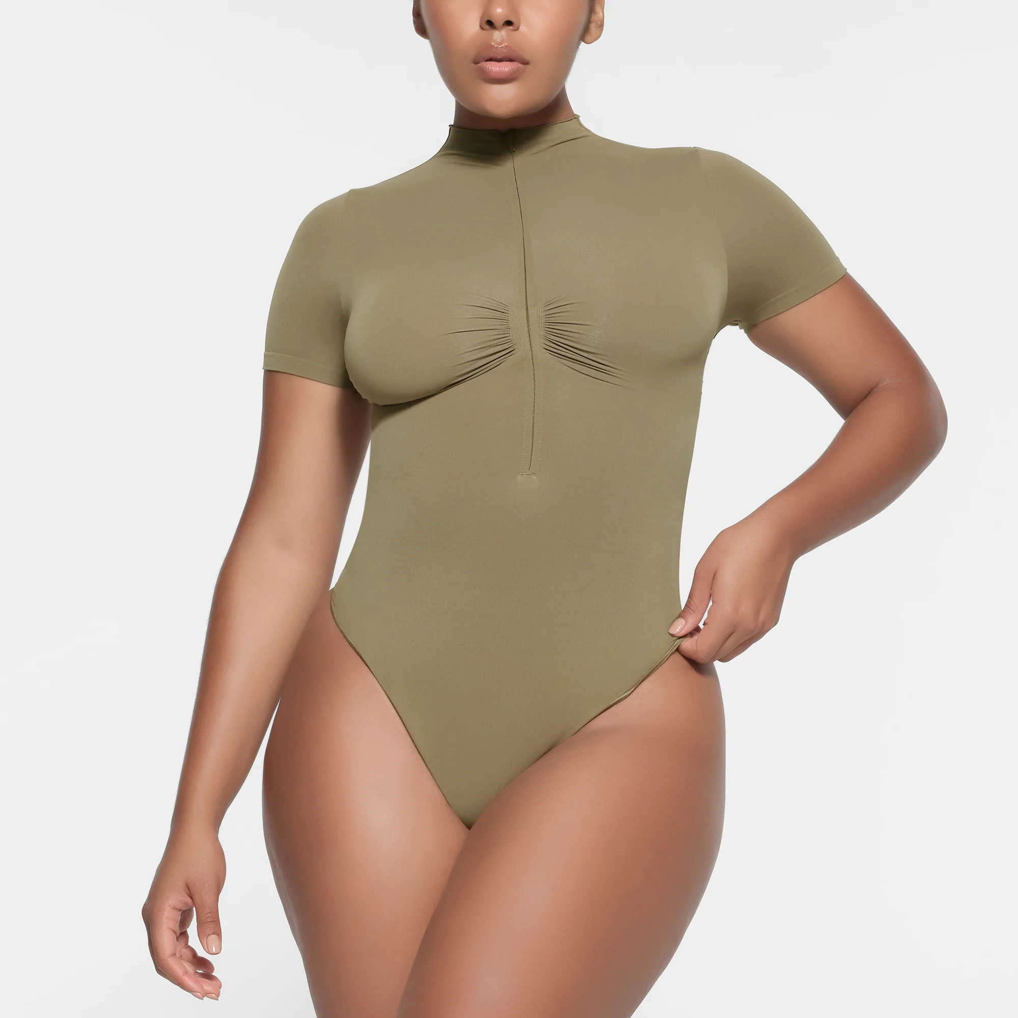 SEAMLESS SCULPT ZIP FRONT T-SHIRT THONG BODYSUIT | ARMY