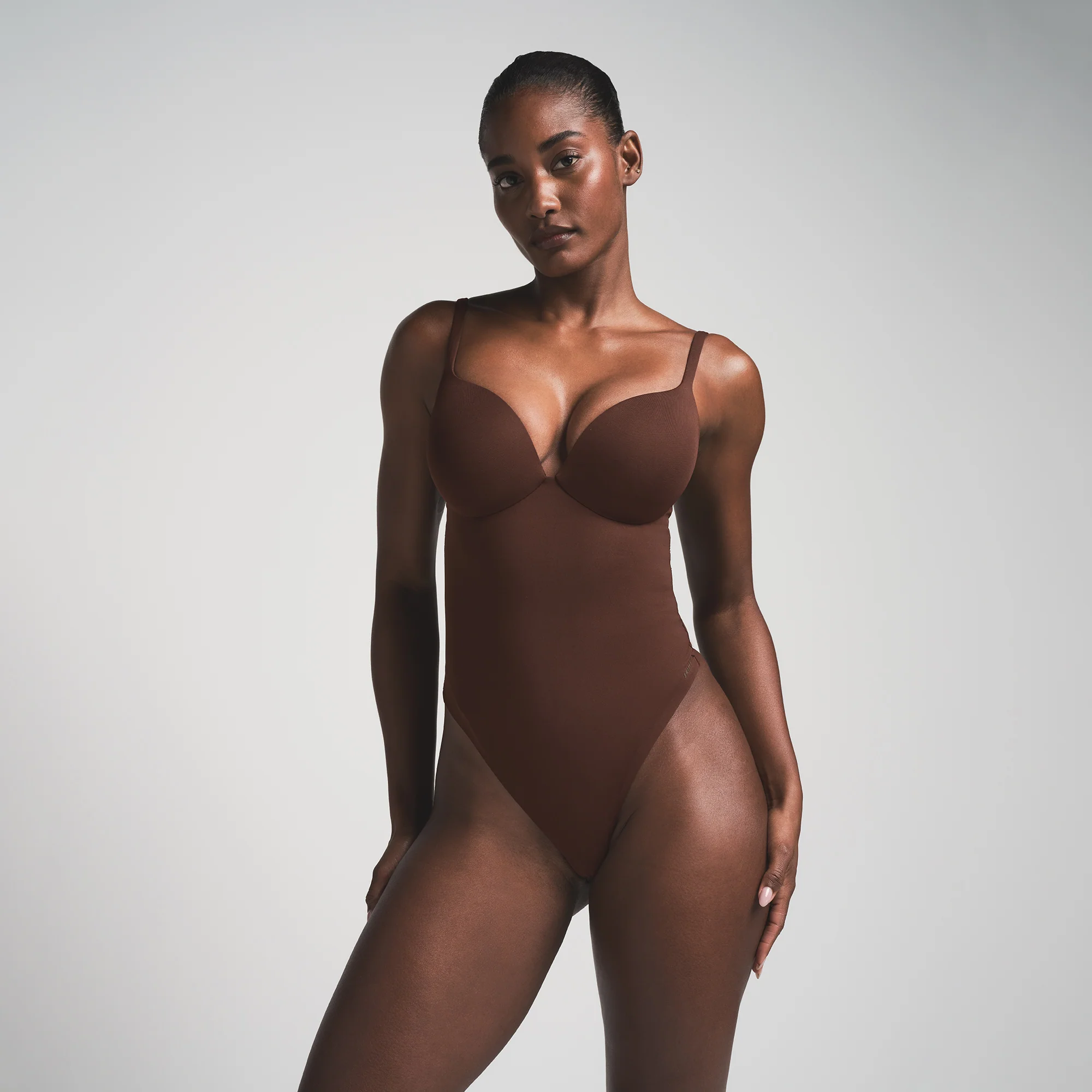 SKIMS ULTIMATE BODY PUSH-UP THONG BODYSUIT | ONYX