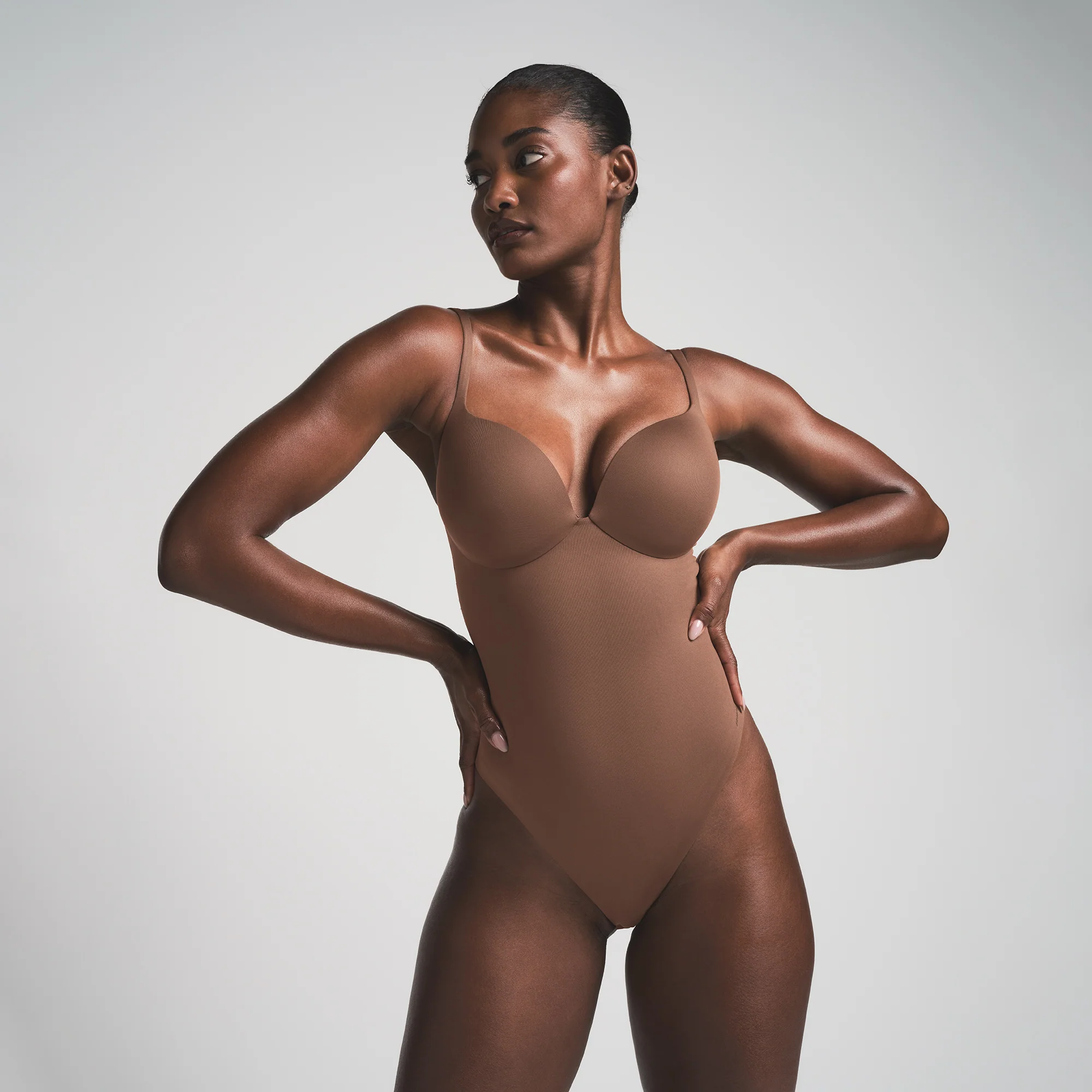 SKIMS ULTIMATE BODY PUSH-UP THONG BODYSUIT | ONYX