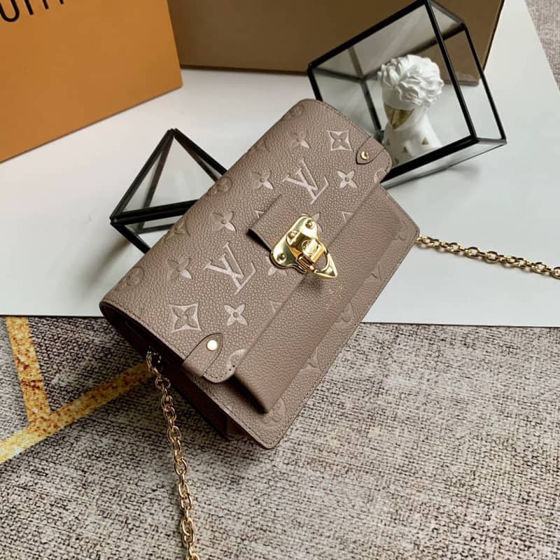 Best Replica Louis Vuitton Monogram Empreinte Vavin Chain Long Wallet Replica Apricot M67839 - Colareps
