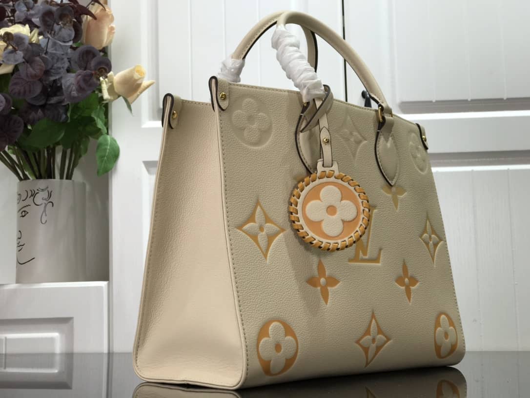 Best Replica Louis Vuitton On the Go MM Monogram Empreinte Two-way Tote Replica Apricot M45717 - Colareps