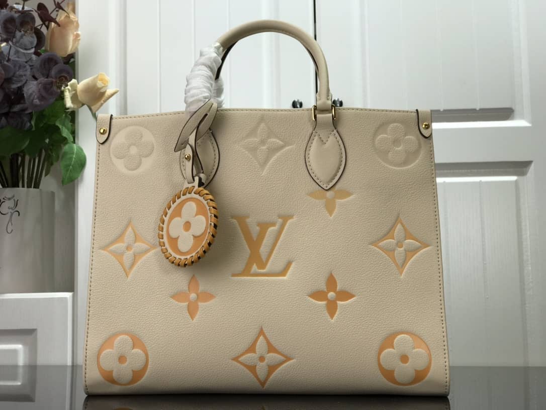 Best Replica Louis Vuitton On the Go MM Monogram Empreinte Two-way Tote Replica Apricot M45717 - Colareps