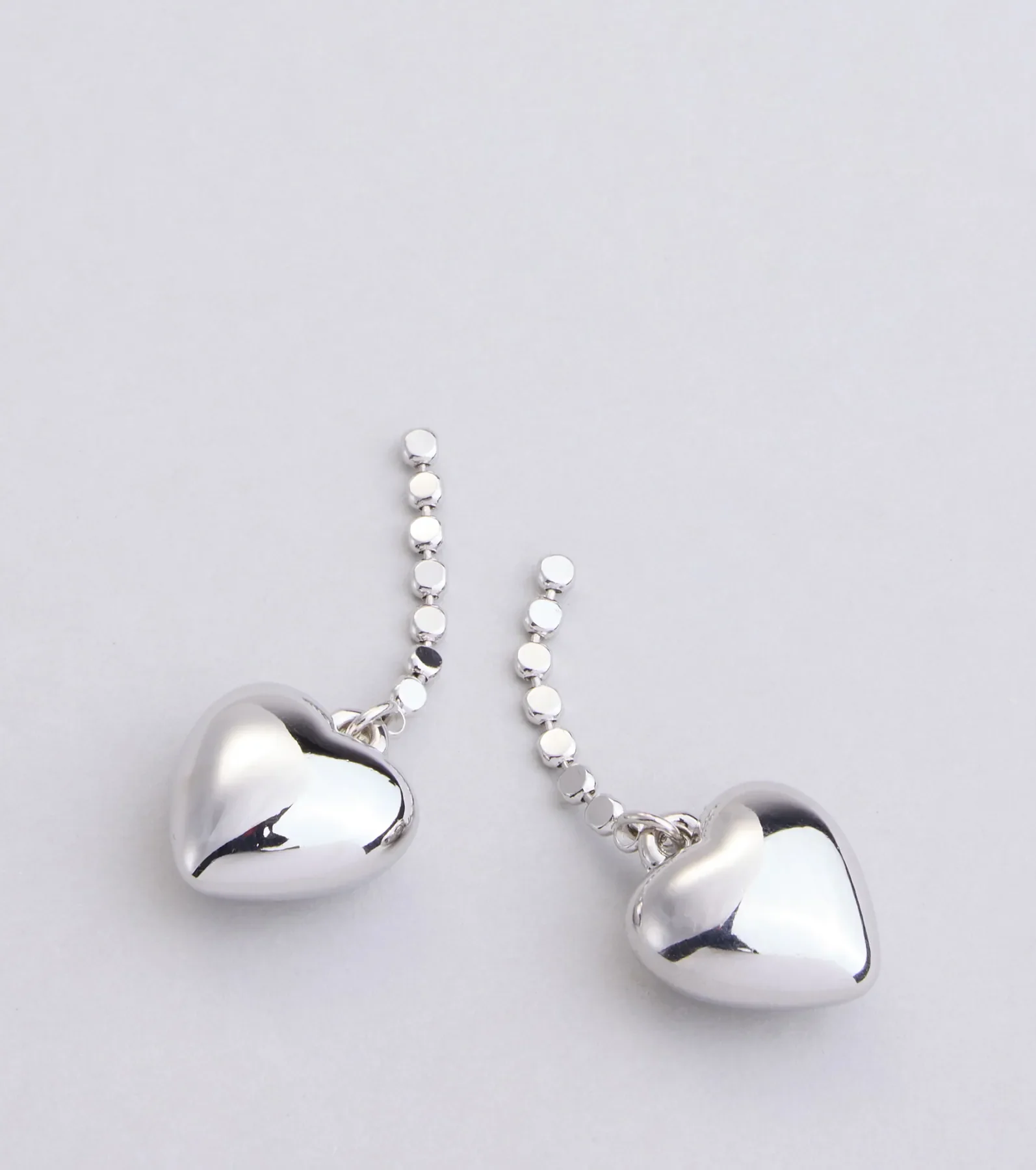 Taking Heart Charm Earrings