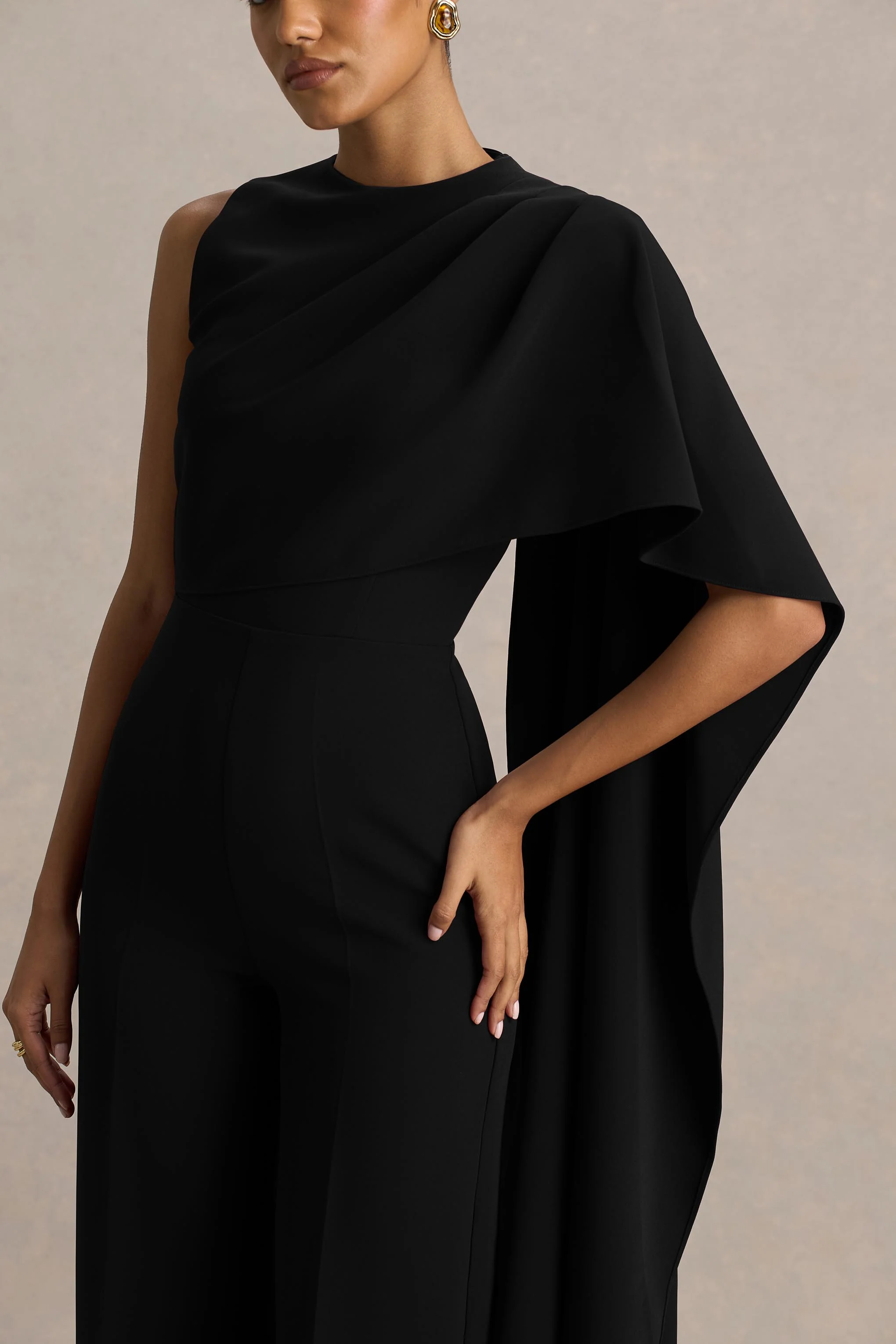 Sorenia | Black High-Neck Jumpsuit With One-Cape Sleeve