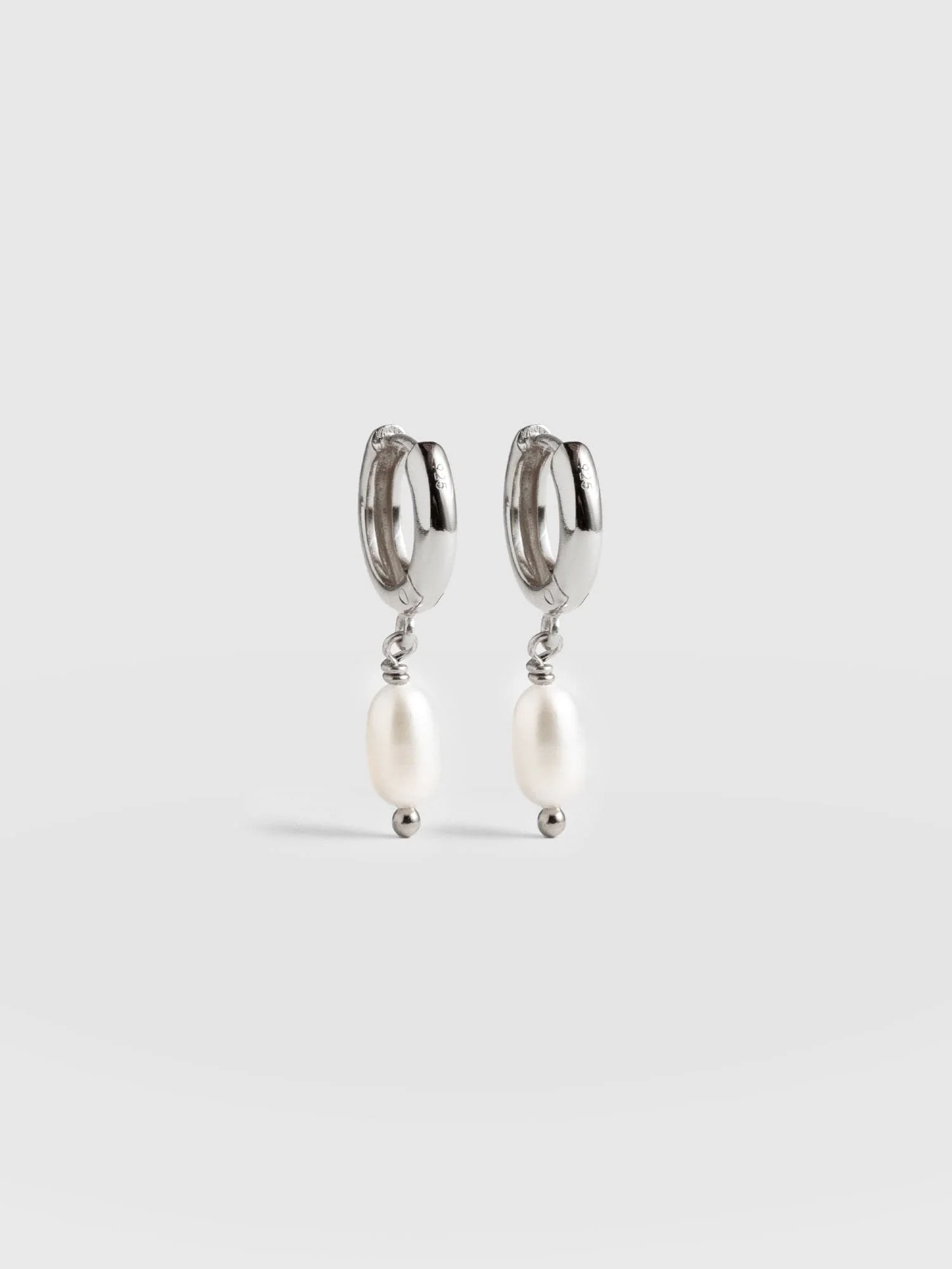 Jacqueline Pearl Huggie Earrings - Silver