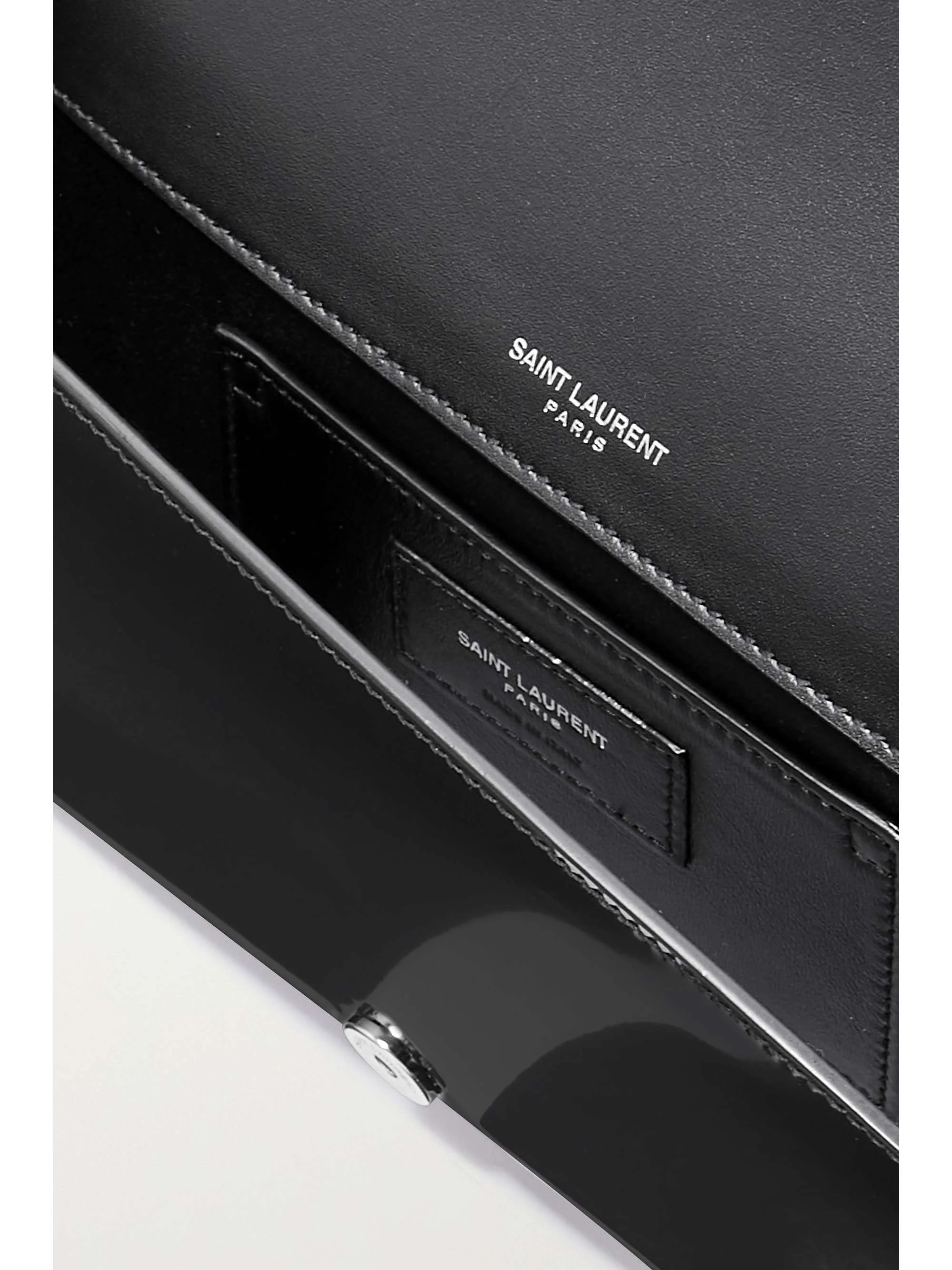Kate glossed-leather clutch