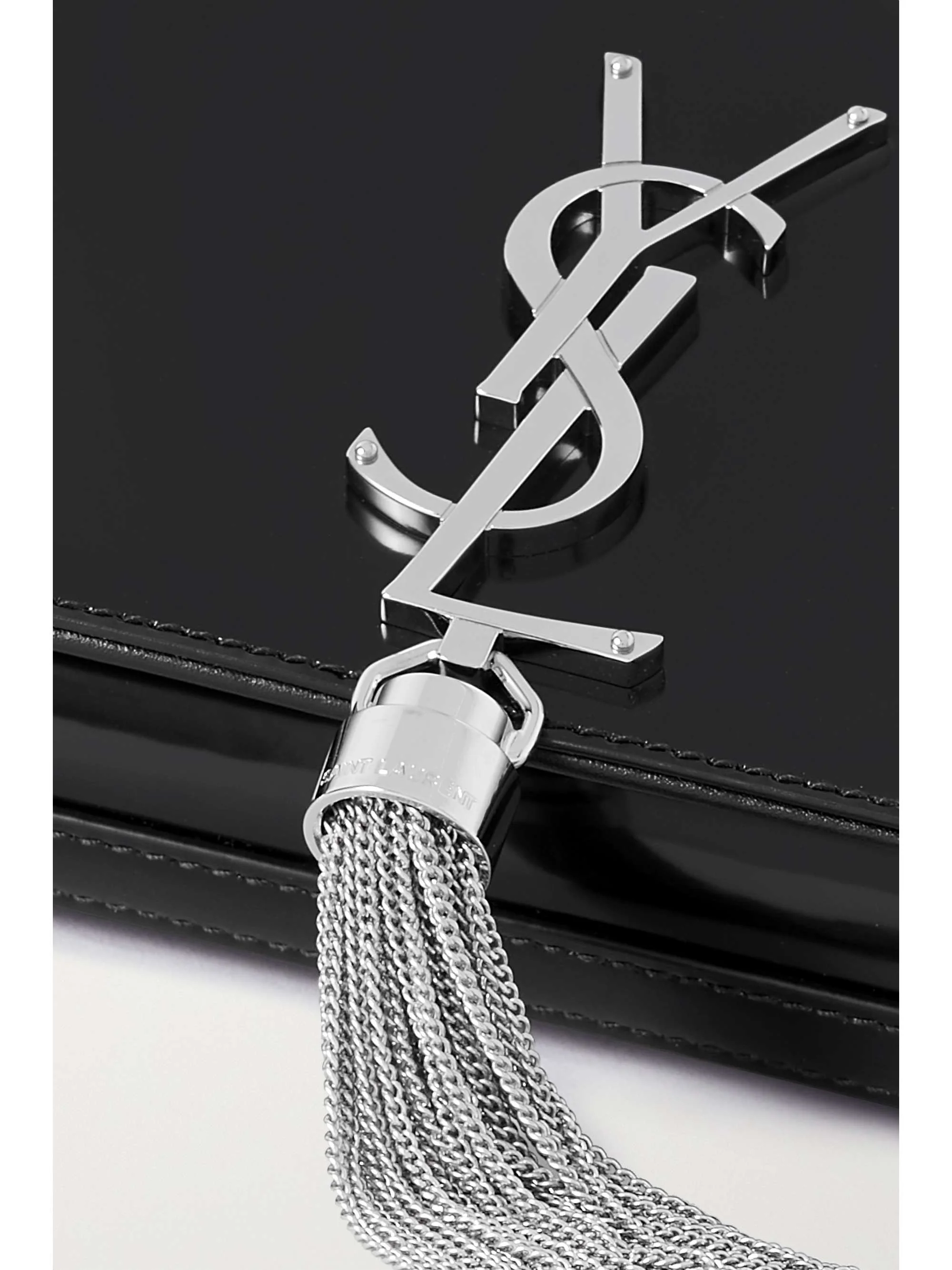 Kate glossed-leather clutch