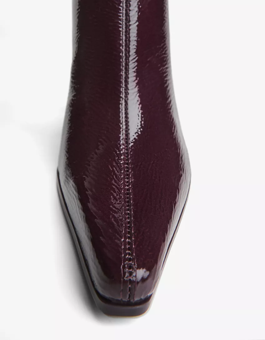 Engraved heel ankle boot