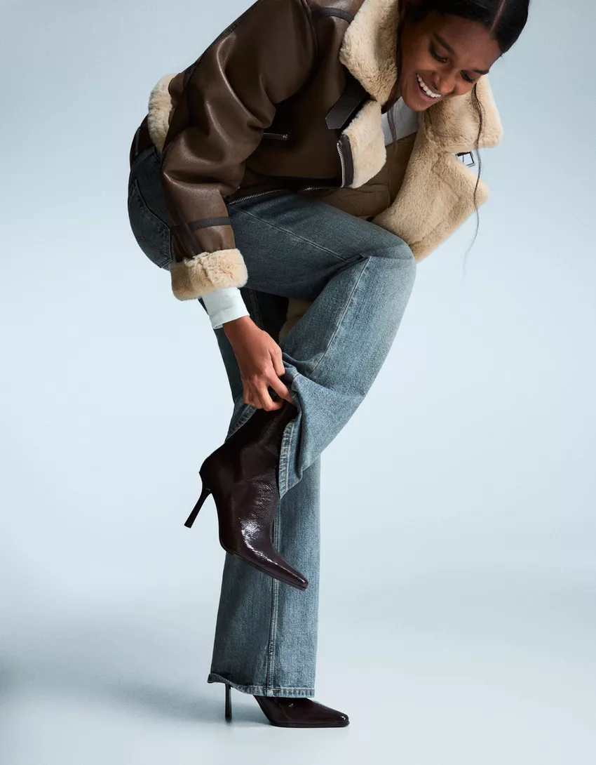 Engraved heel ankle boot