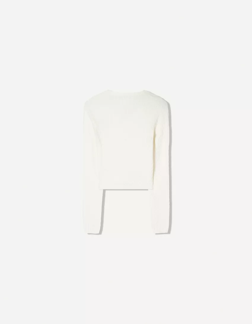 Cable-knit sweater with embroidery