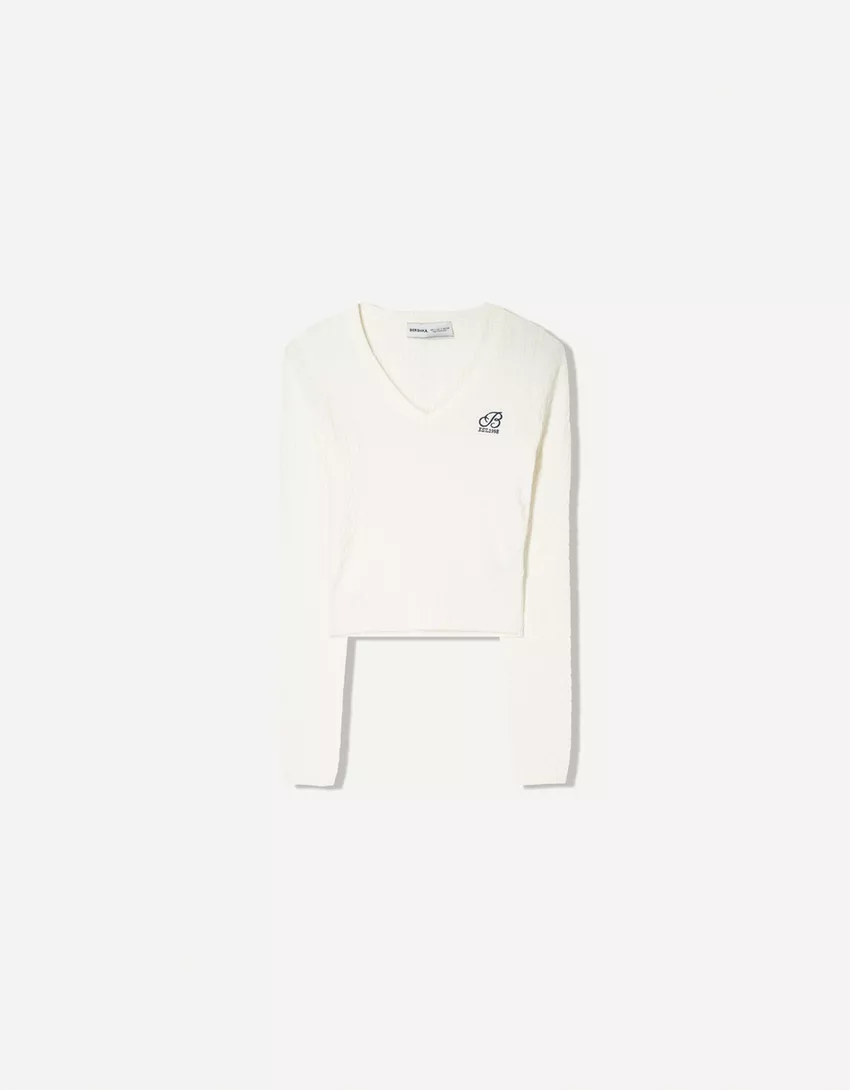 Cable-knit sweater with embroidery