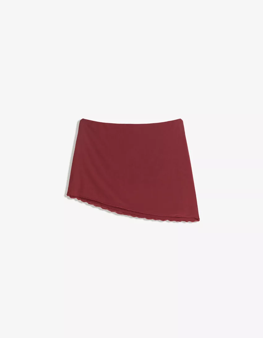 Asymmetric embroidered mini skirt
