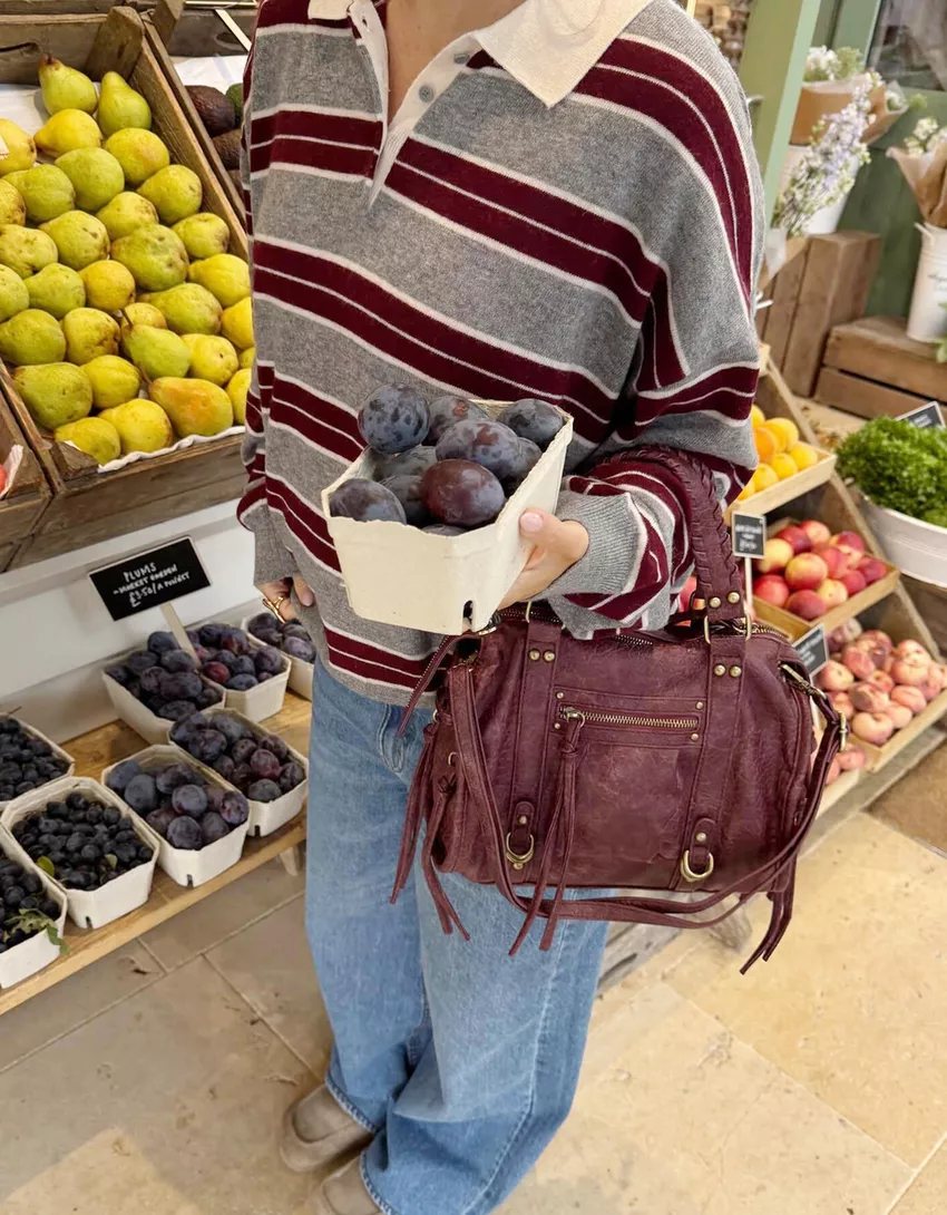 Worn-effect bowling bag with straps