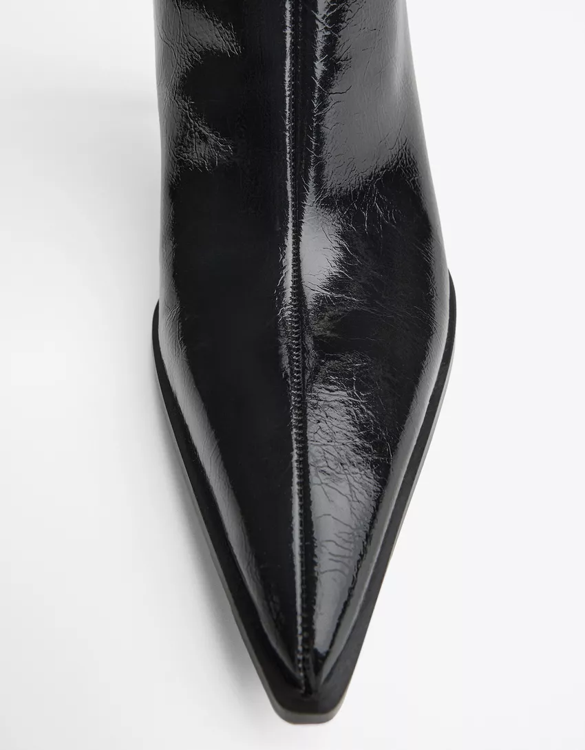 Heeled ankle boot with buckle strap