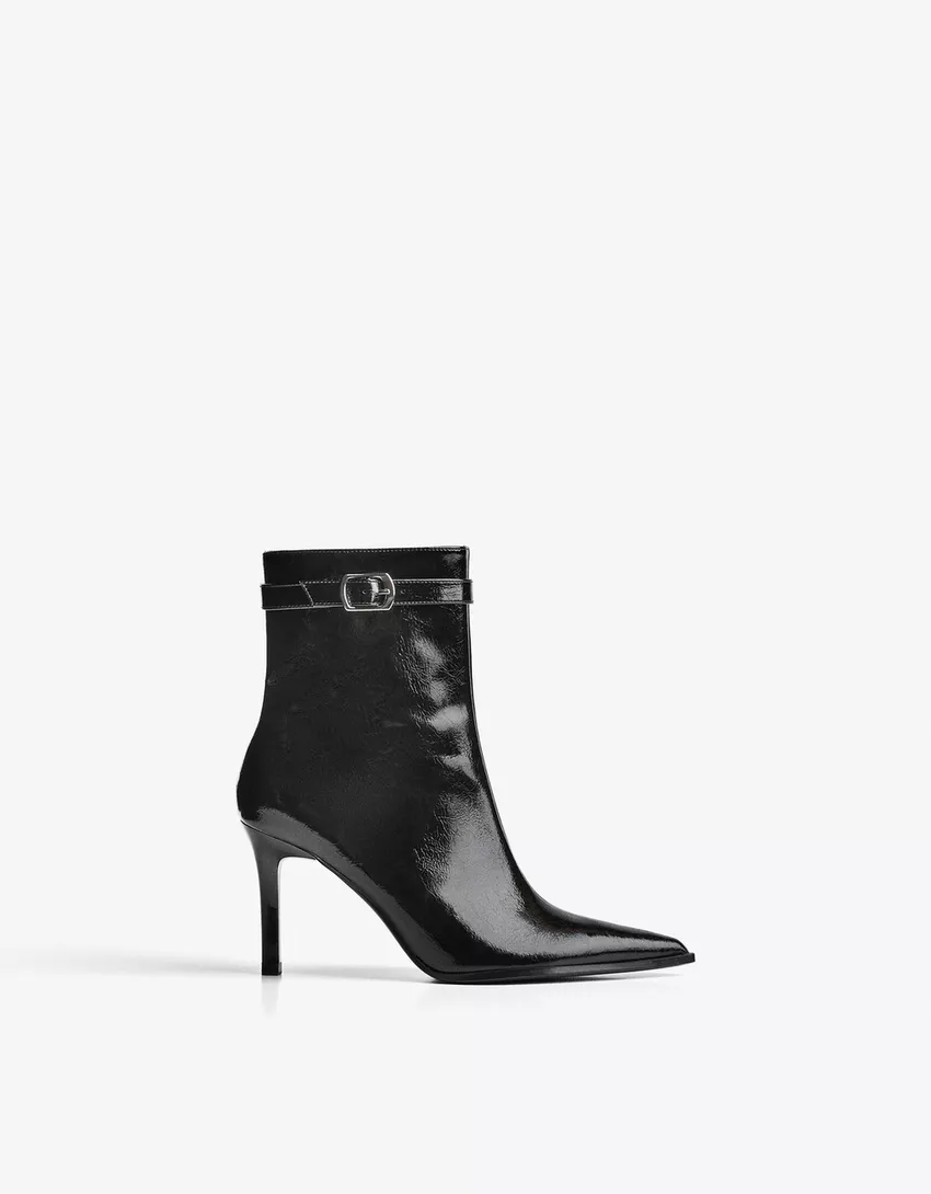 Heeled ankle boot with buckle strap