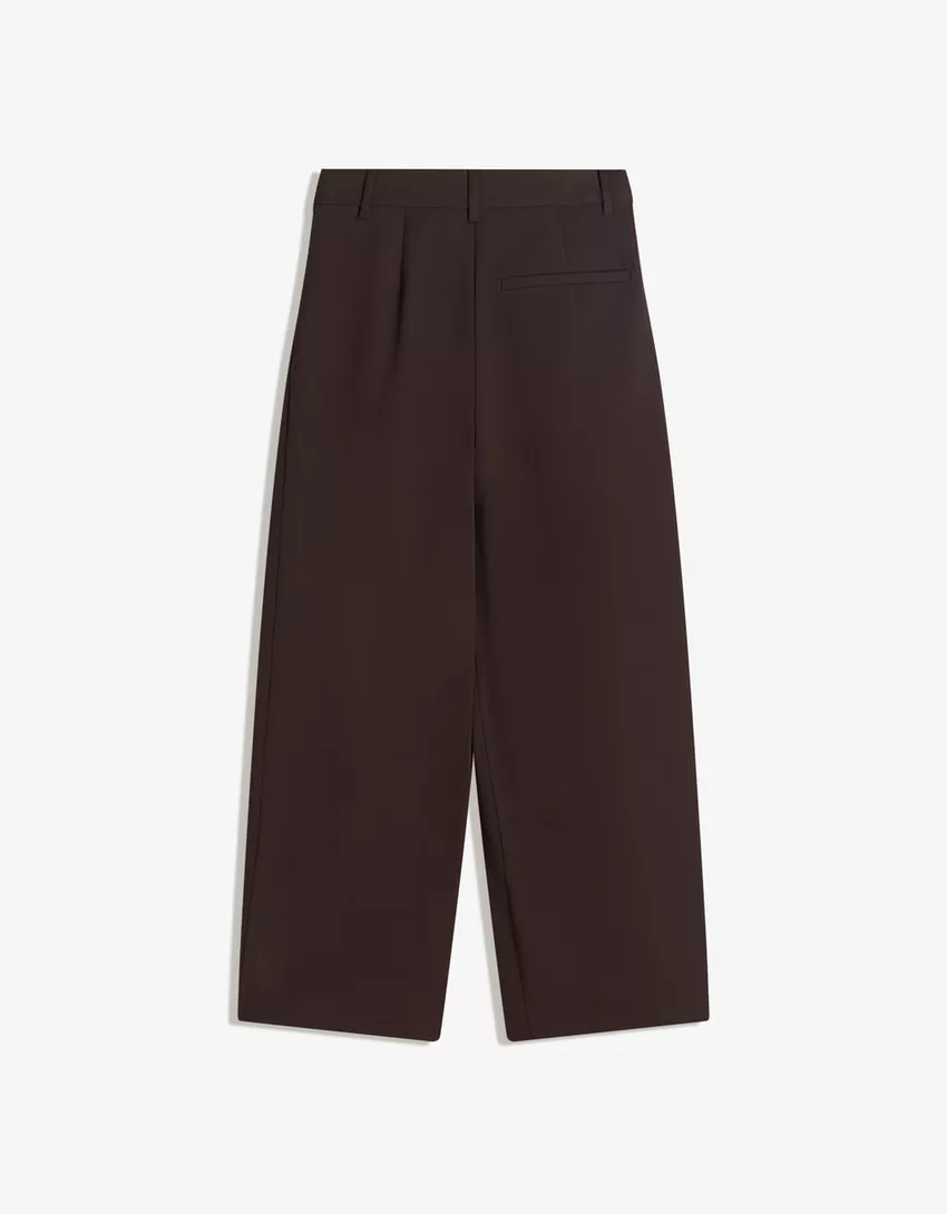 Tailored pants with crossover waistband