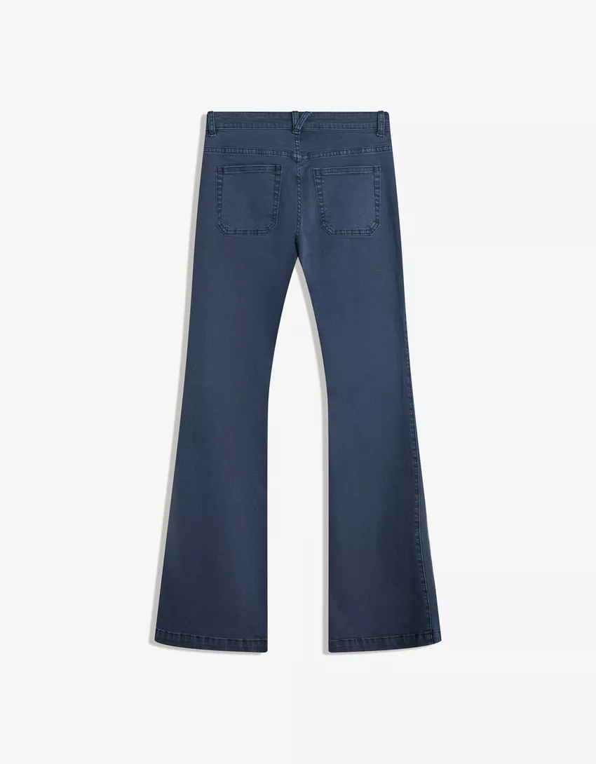 Flared pants with pocket flaps