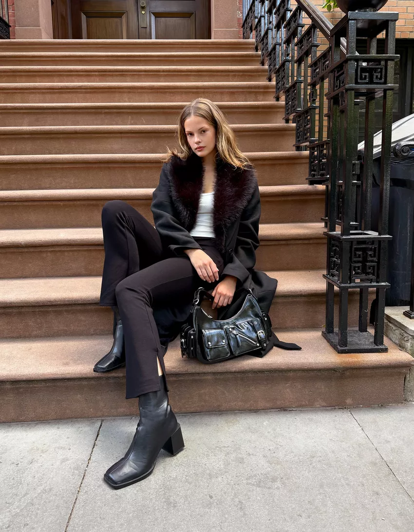 Coat with a detachable faux fur collar