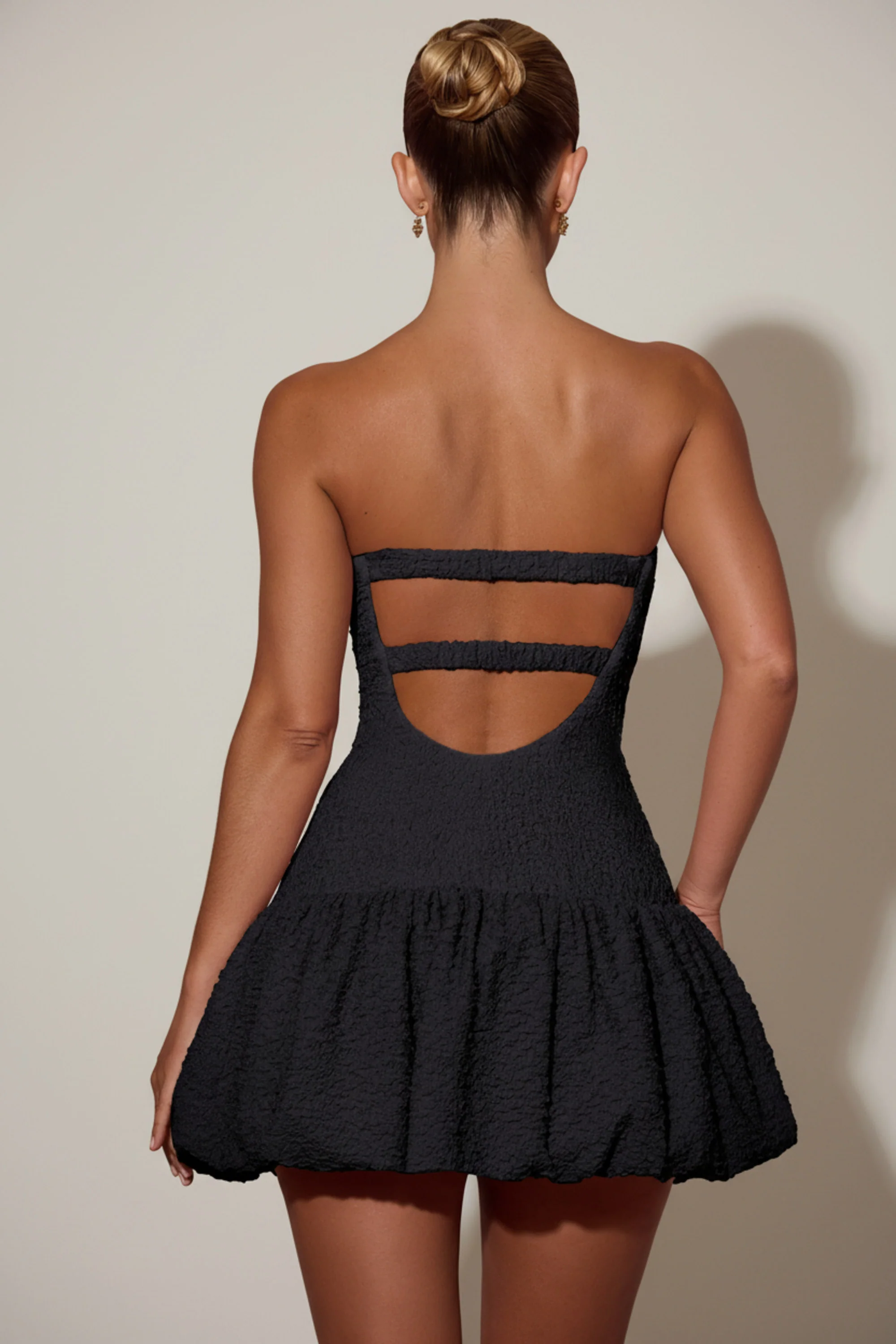 Cut-Out Bubble Hem Corset Mini Dress in Black