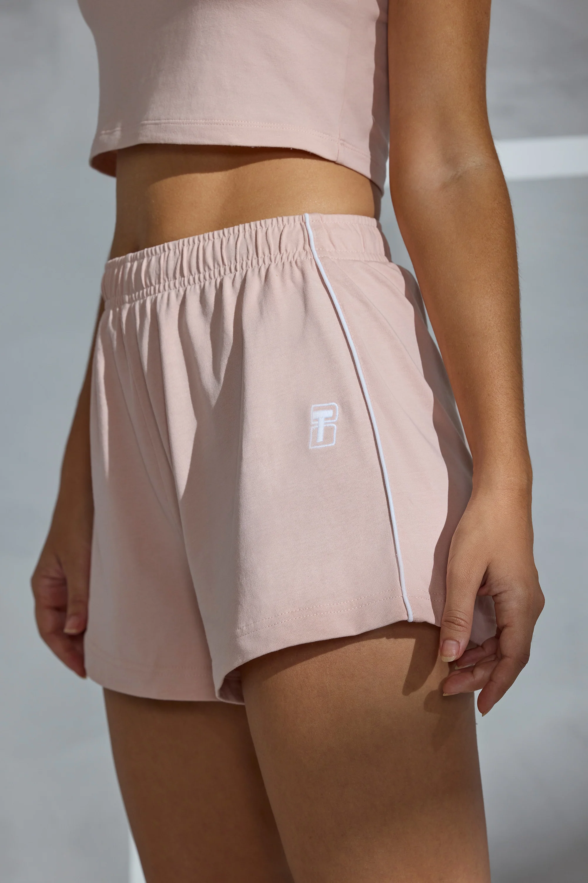 On Track - Piped Detail Mini Sweat Shorts in Soft Peach