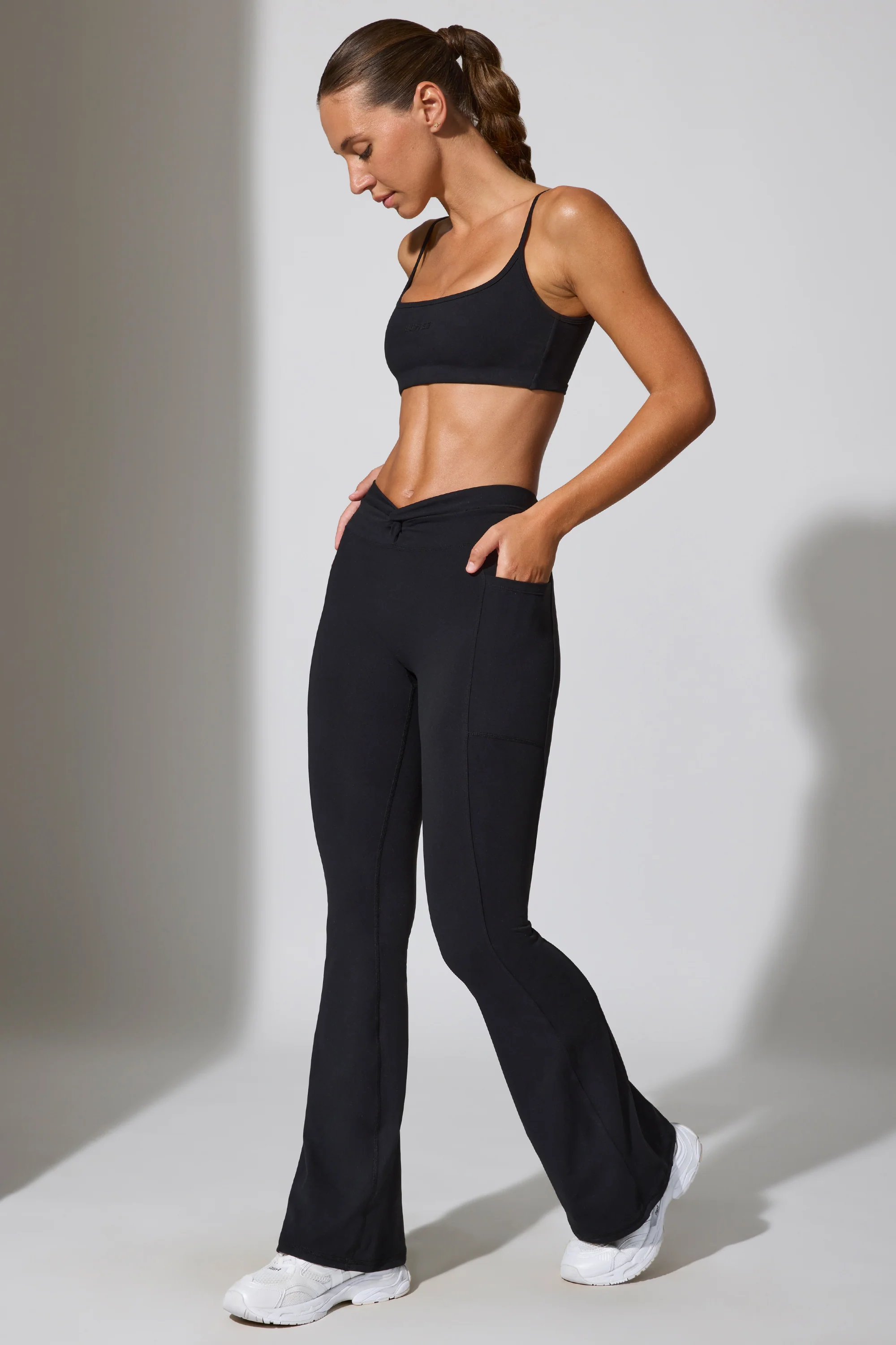 Realign - Twist Waist Flare Leggings in Black