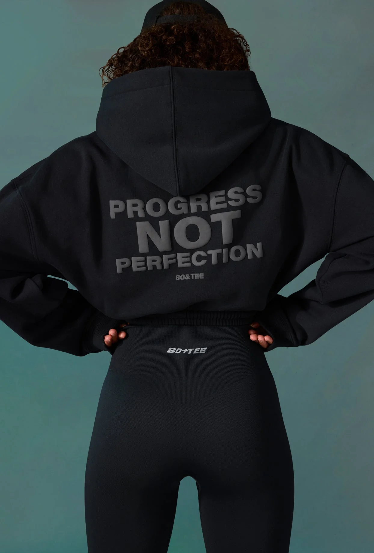 Progress - Cropped Drawstring Hooded Sweatshirt in Black