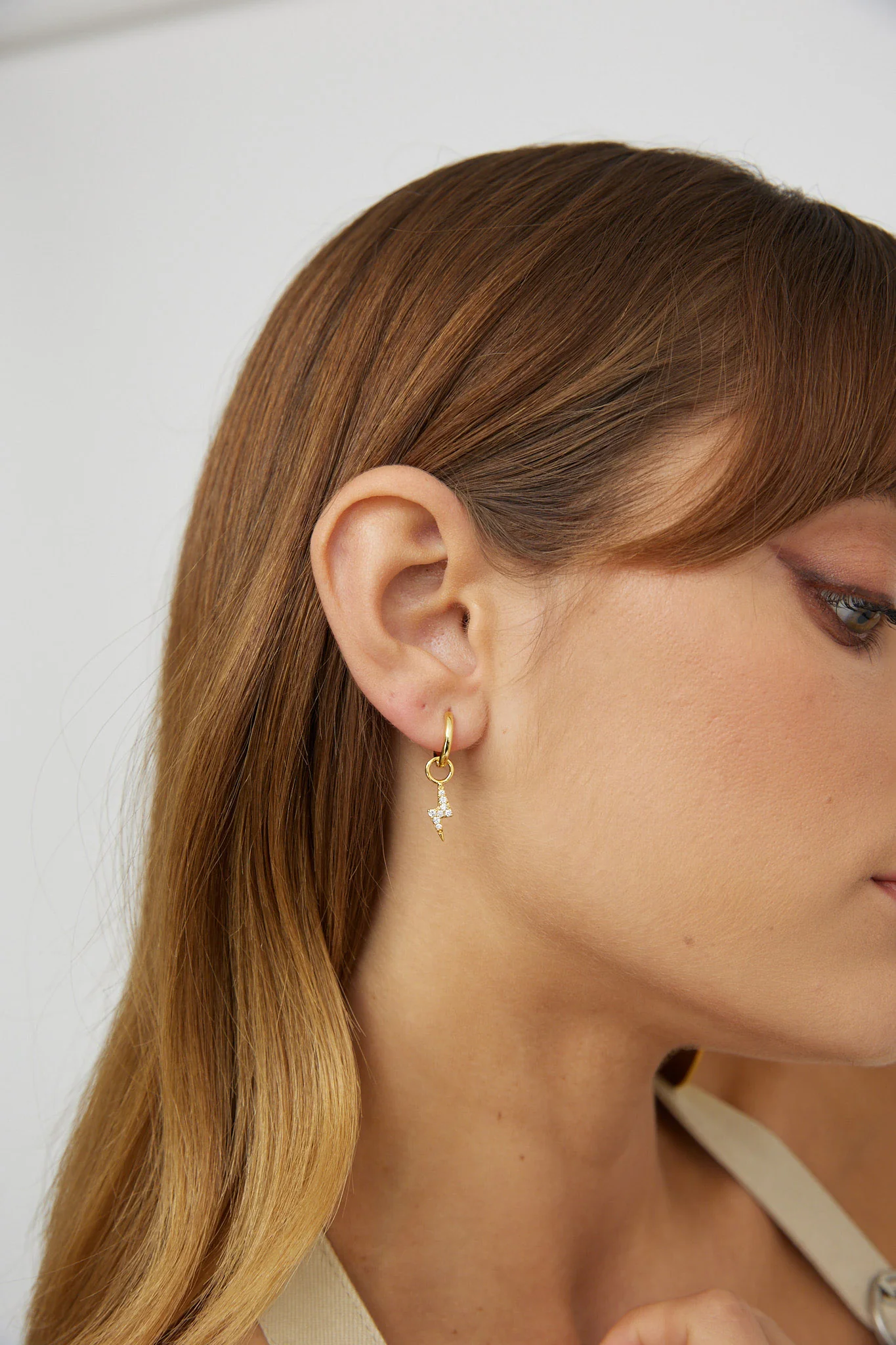 Celeste Lightning Zircon Earrings Gold