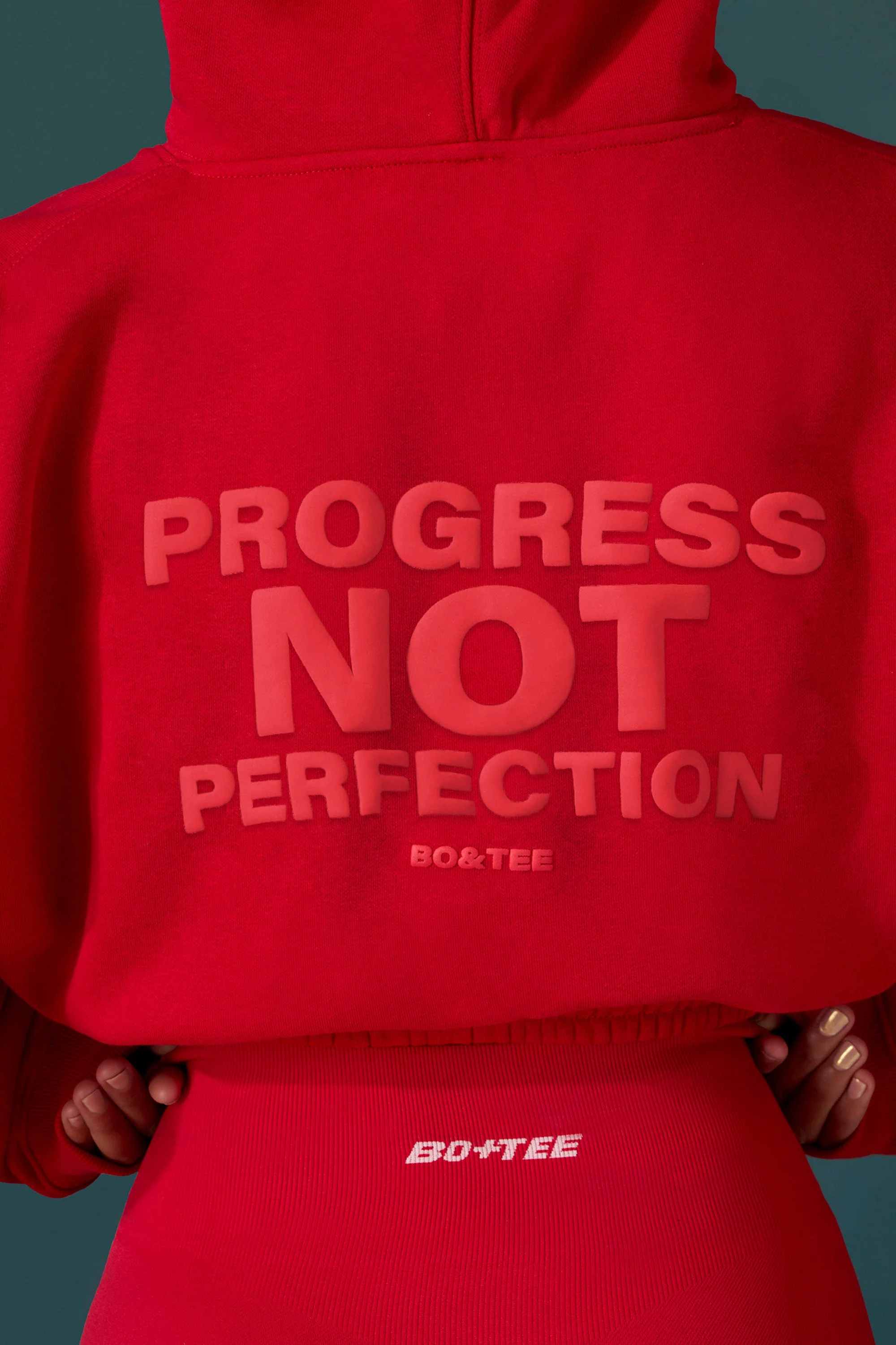 Cropped Drawstring Hooded Sweatshirt in Tango Red