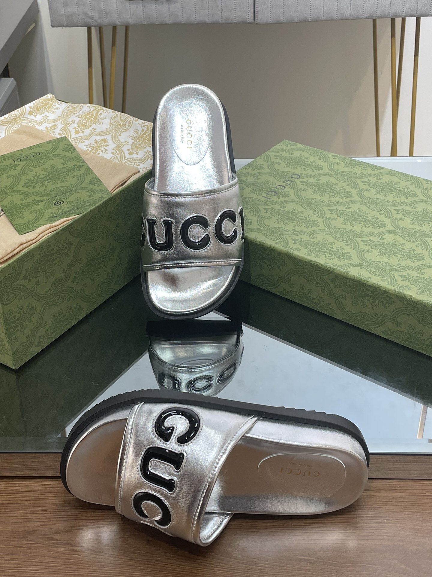 Gucci slippers with large platform logos