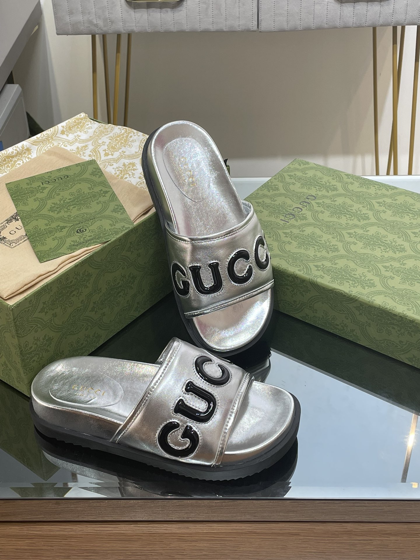 Gucci slippers with large platform logos