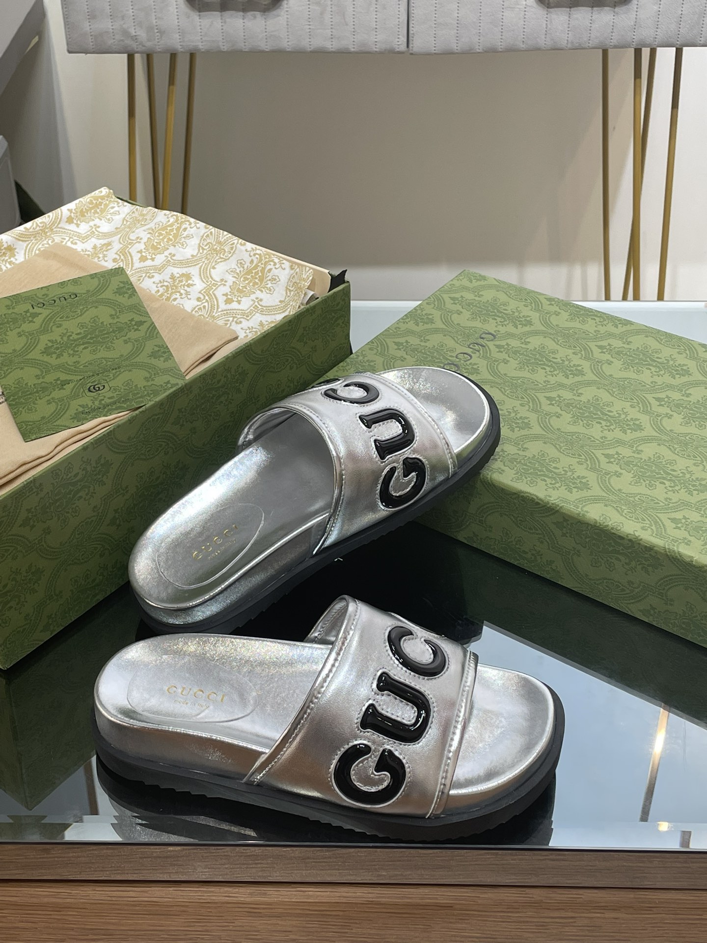 Gucci slippers with large platform logos