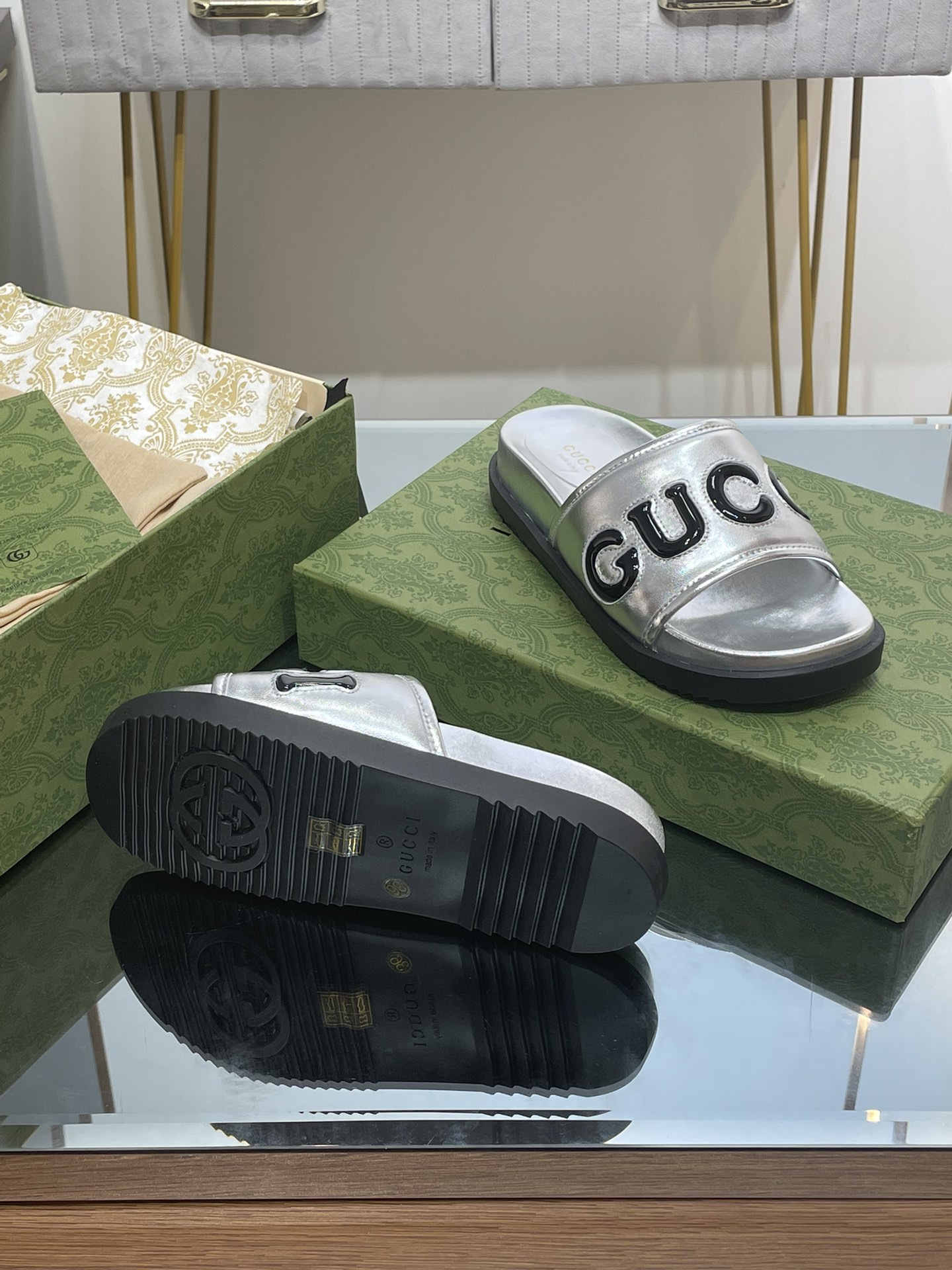 Gucci slippers with large platform logos