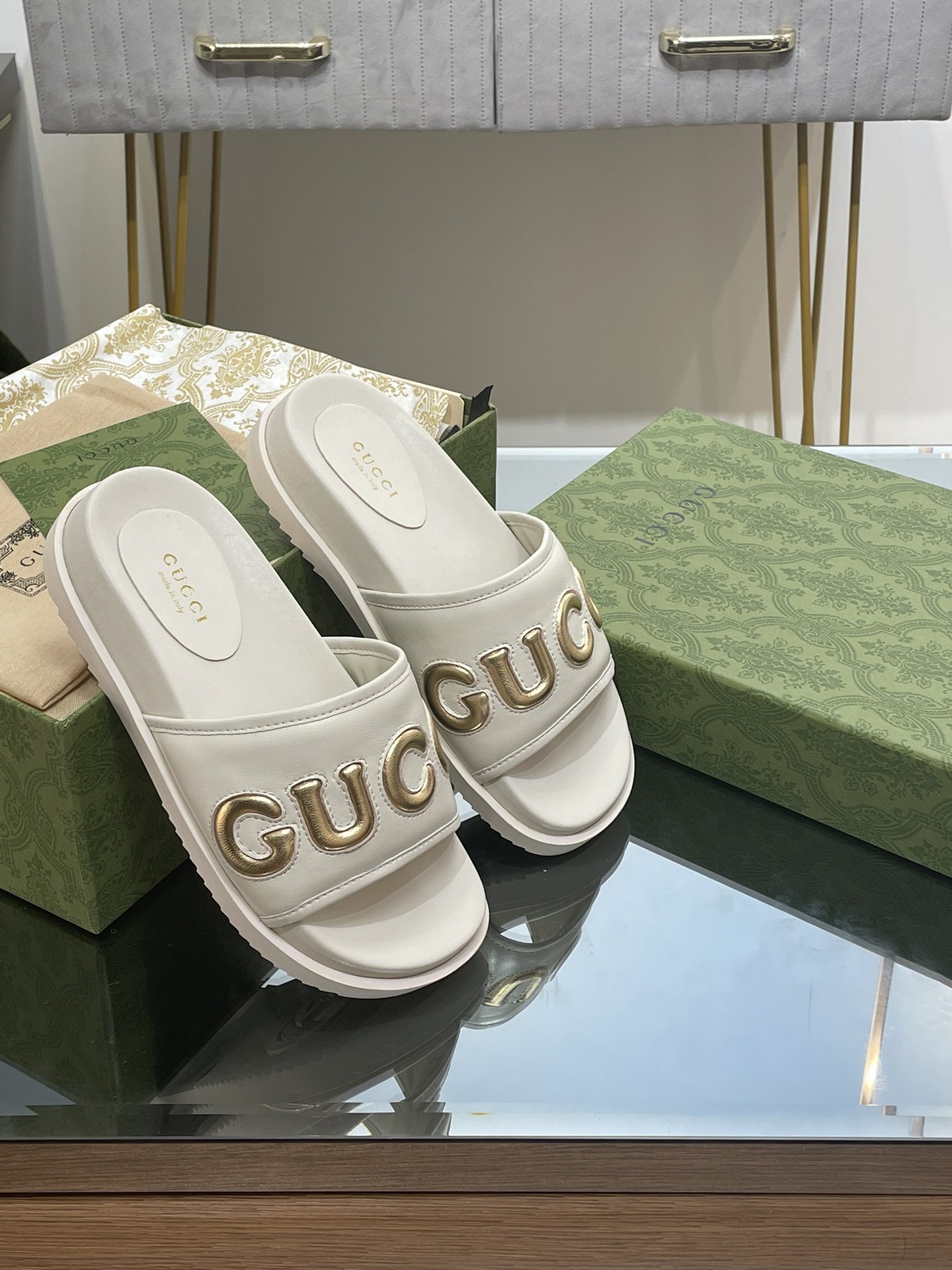 Gucci slippers with large platform logos