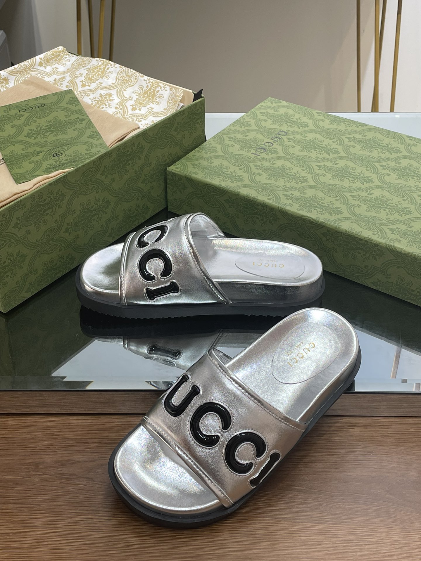 Gucci slippers with large platform logos