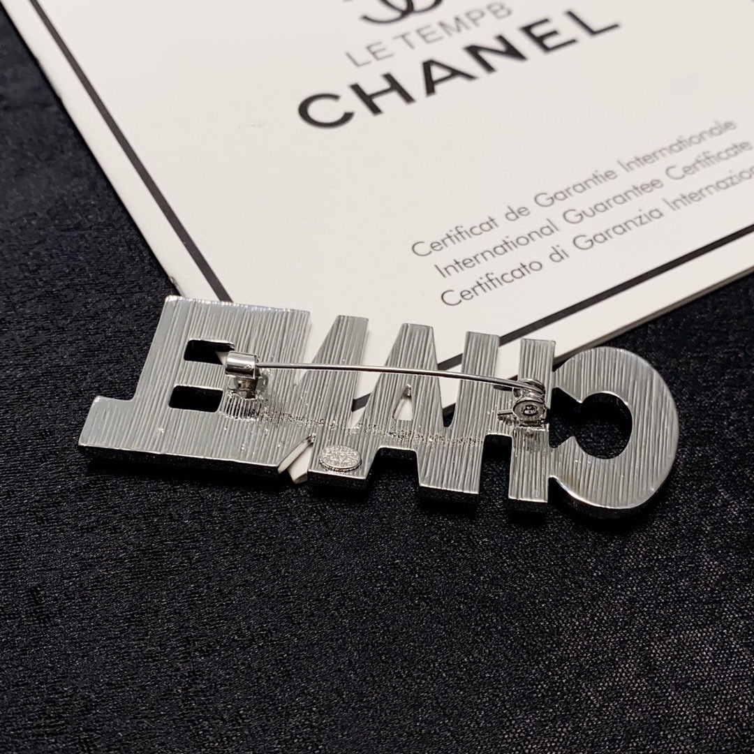 CHANEL lettering all-over diamond Chanel brooch