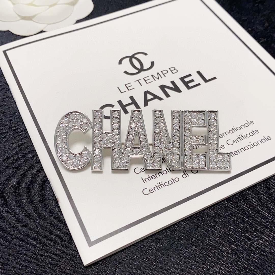 CHANEL lettering all-over diamond Chanel brooch