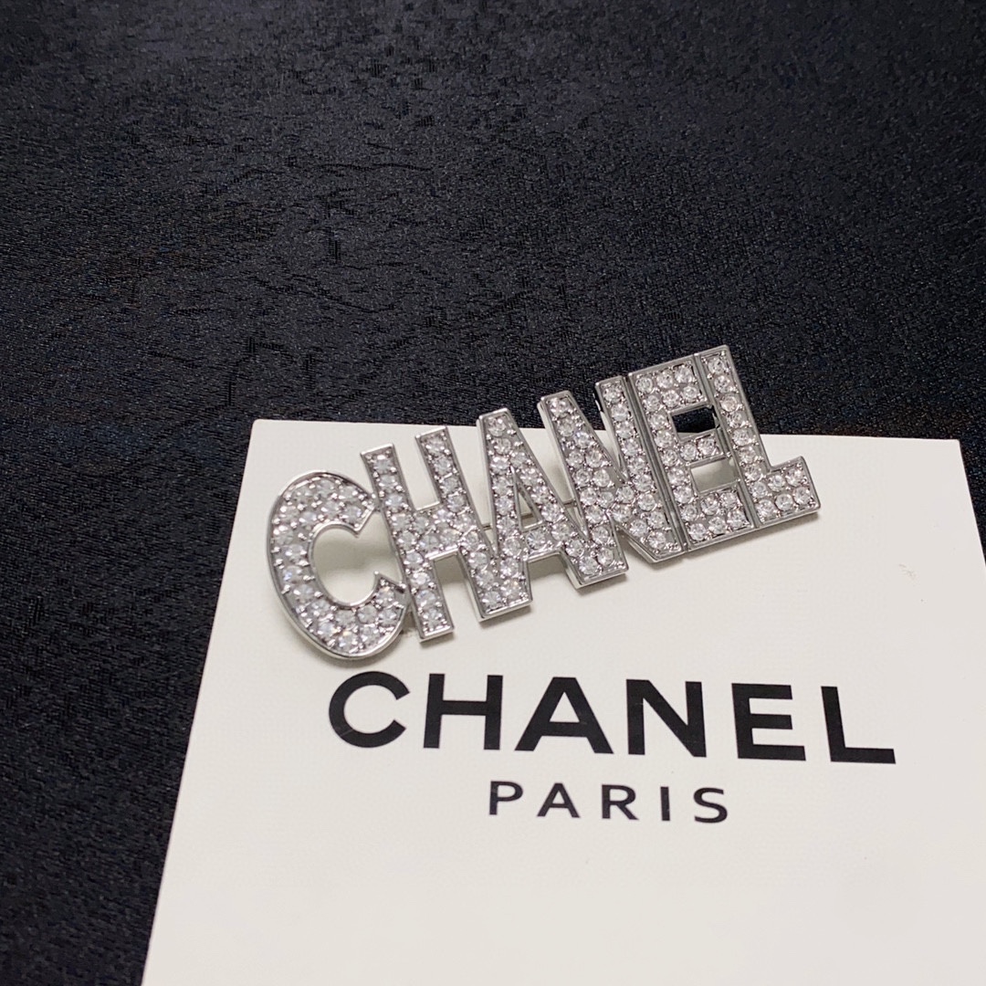 CHANEL lettering all-over diamond Chanel brooch