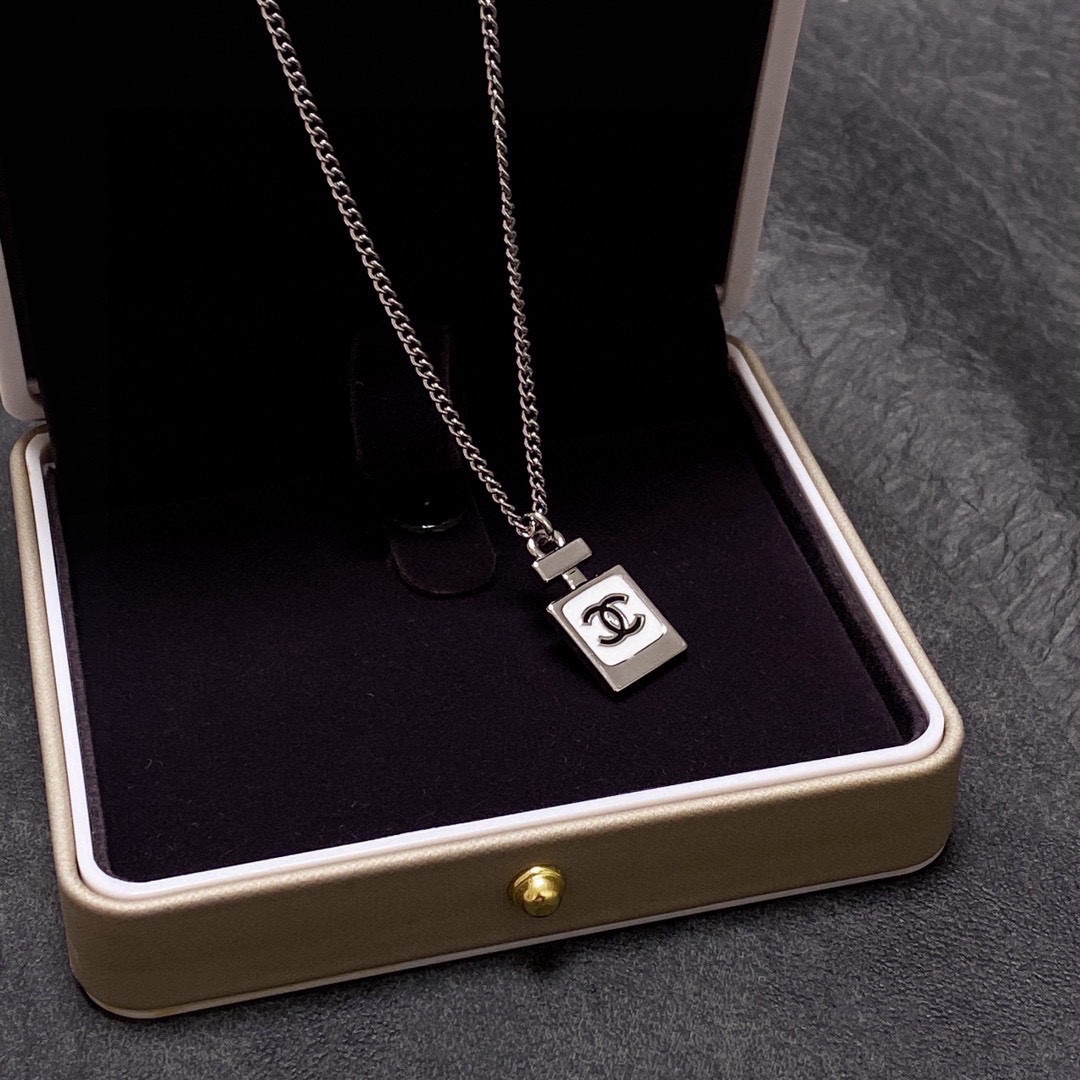 Chanel Double C perfume bottle necklace