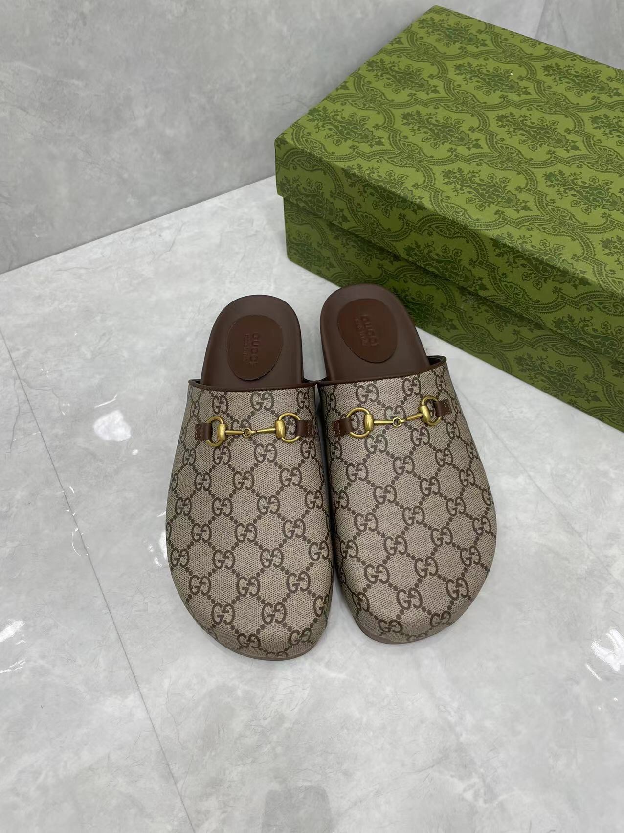 Gucci couple's matching slippers, the GG horsebit mules