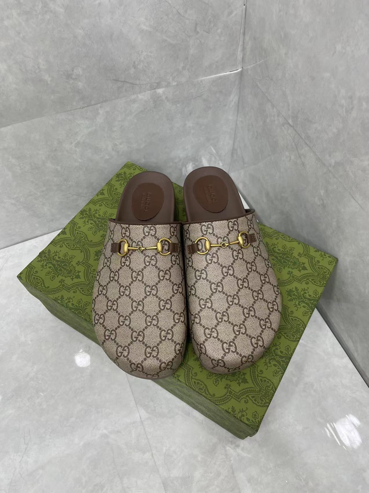 Gucci couple's matching slippers, the GG horsebit mules